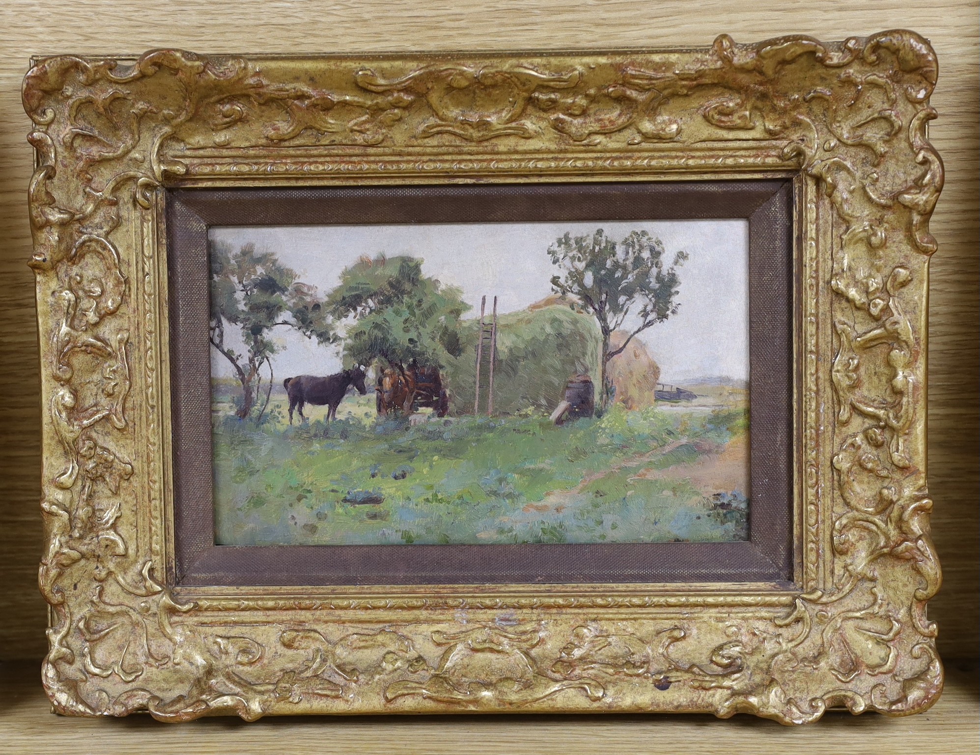 Percy Tarrant (1855-1934), oil on board, Horses beside a haystack, inscribed verso, 13 x 22cm